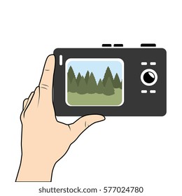 hand holding digital camera with screen