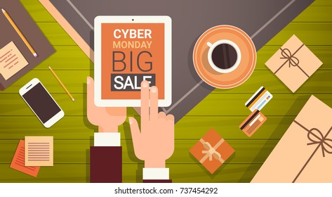 Hand Holding Digital Tablet With Cyber Monday Big Sale Message, Online Shopping Poster Over Cell Smart Phone, Credit Cards And Office Stuff On Workplace, Angle View Vector Illustration