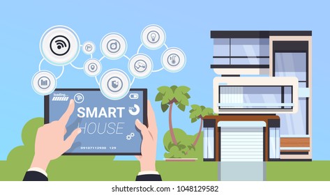Hand Holding Digital Tablet With Smart Home Control And Administration System Interface Concept