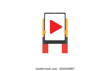 hand holding digital tablet with video icon 