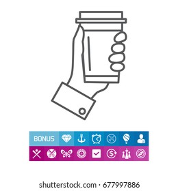 Hand holding disposable coffee cup