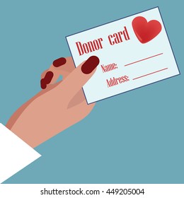 Hand holding Donor Card. 