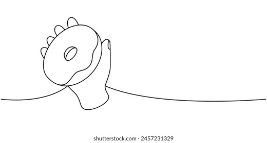 Mano sosteniendo la rosquilla con hielo una línea de dibujo continuo. Panadería dulce pastelería. Ilustración lineal de Vector.