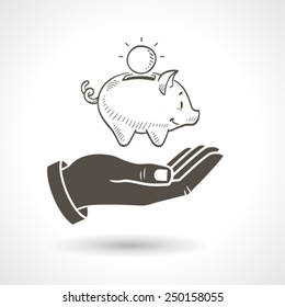 Hand holding a hand drawn vector piggy bank, vector icon.