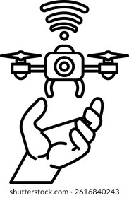 A hand is holding a drone