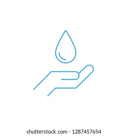 Hand holding drop of water