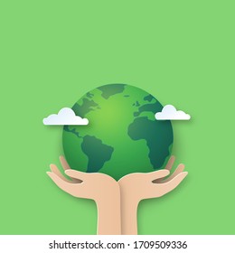 Hand holding earth.Paper cut of world environment day background.