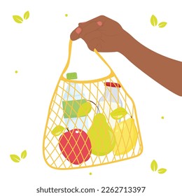 Hand holding an eco bag full of products.