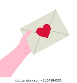 Hand holding an envelope with a red heart