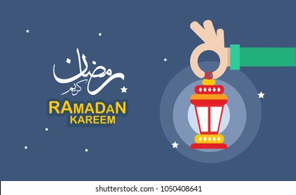 hand holding "fanous" means lantern ..Ramadan Kareem greeting card hand holding "fanous" means lantern ..Ramadan Kareem greeting card