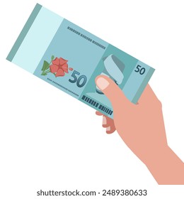 Hand holding fifty Ringgit Malaysia currency banknote cash paper money.
