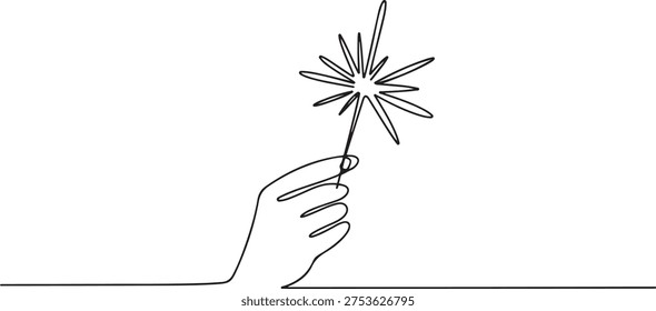 Hand holding fireworks in