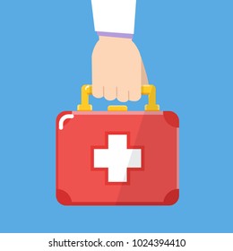 Hand Holding First aid kit box. Flat design. Vector illustration.