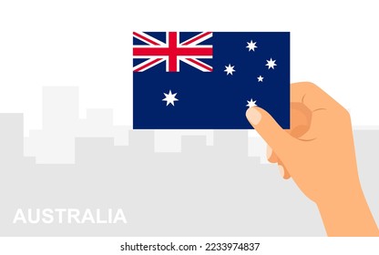 Hand holding a flag of Australia on city background in minimal flat style. Vector illustration