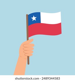 Hand holding a flag of Chile. Vector illustration of the Chile flag in flat style isolated on blue background.