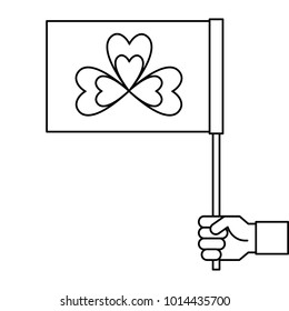 hand holding flag with clover symbol outline