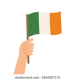 Hand holding a flag of Ireland. Vector illustration of the Irish flag in flat style isolated on while background.