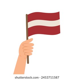 Hand holding a flag of Latvia. Vector illustration of the Latvian flag in flat style isolated on white background.