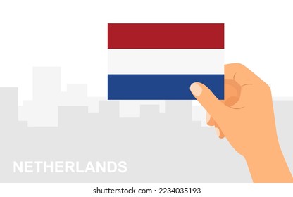 Hand holding the flag of Netherlands on the background of the city in minimal flat style. Vector illustration