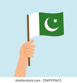 Hand holding a flag of Pakistan. Vector illustration of the Pakistan flag in flat style isolated on blue background.