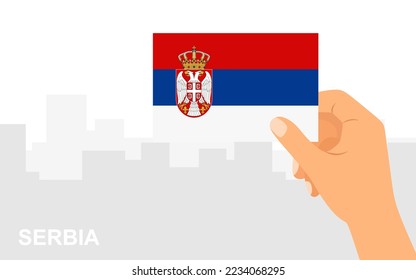 Hand holding the flag of Serbia on the background of the city in minimal flat style. Vector illustration