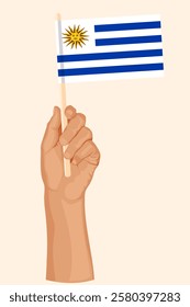 Hand holding the flag of Uruguay. Patriotic illustration in simple flat style