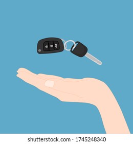 hand is holding the floating remote car key. Rental, sale, loan, buy vehicle. Transportation concept.