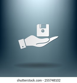 hand holding a floppy, diskette. symbol store information document. computer floppy disk icon .