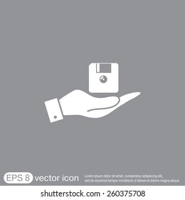 hand holding a floppy, diskette. symbol store information document. computer floppy disk icon .