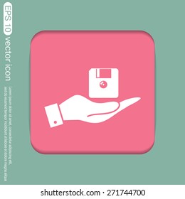 hand holding a floppy, diskette. symbol store information document. computer floppy disk icon .
