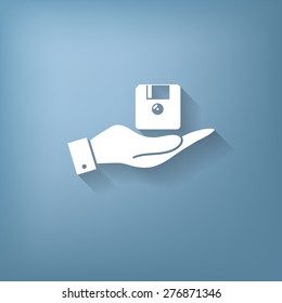 hand holding a floppy, diskette. symbol store information document. computer floppy disk icon .