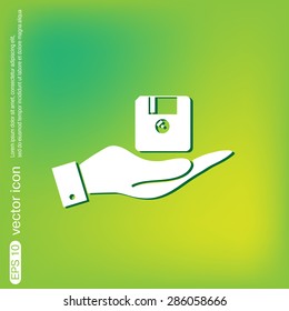 hand holding a floppy, diskette. symbol store information document. computer floppy disk icon .