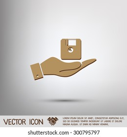 hand holding a floppy, diskette. symbol store information document. computer floppy disk icon .