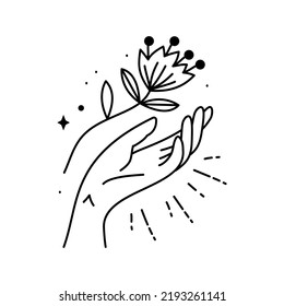 Hand, die eine Blume hält. Magisches Boho-Symbol. Zigeuner heiliger Bestandteil und Zeichen im modernen Boho Stil. Goldene minimale Linienkunst.