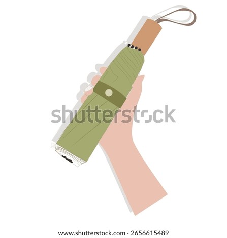 hand holding a folding umbrella.Folded umbrella. Compact collapsible umbrella, rain protection accessory with handle, 