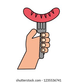 hand holding fork with sausage