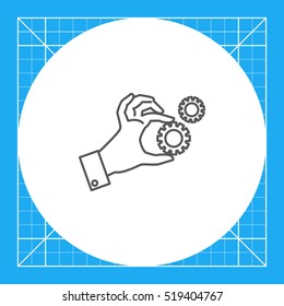 Hand holding gear wheels