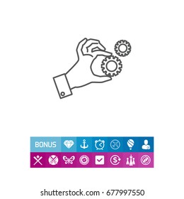Hand holding gear wheels