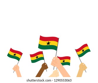 Hand holding Ghana flags isolated on white background