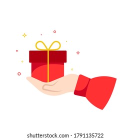 Hand holding a gift box isolated on white background. Flat cartoon style vector illustration	 	