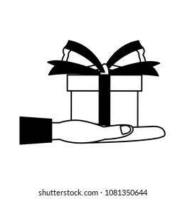 Hand holding gift box on black and white colors