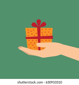 Hand holding a gift box or present in a gesture of giving. Vector illustration