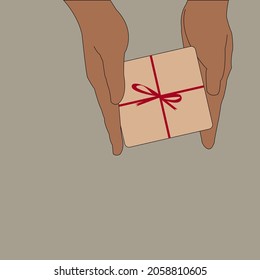 hand holding a Gift Box with red ribbon