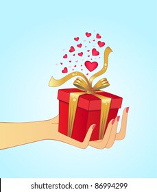 Hand holding gift, suitable for christmas or Valentine's day