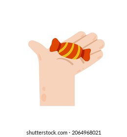 Mano sosteniendo y dando un caramelo en envoltura roja. Dulce.