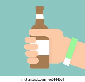Hand holding a glass of beer