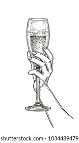 Hand Holding A Glass Of Champagne. Ink Sketch Isolated On White Background. Hand Drawn Vector Illustration. Retro Style.