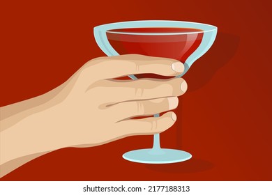 Hand holding glass of cocktail. beautiful male hand holding a glass with a red drink