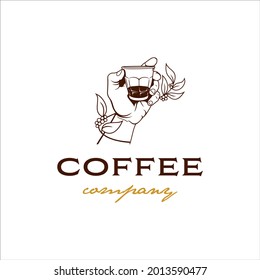 Hand holding glass of espresso shot logo with vintage design style