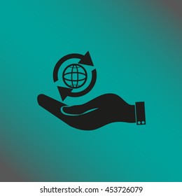 hand holding a globe